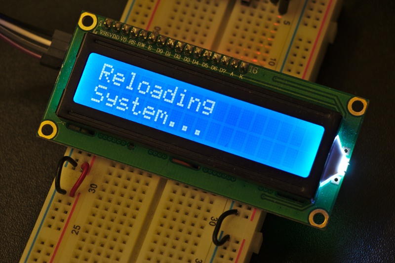 The screen is displaying "Reloading system..."